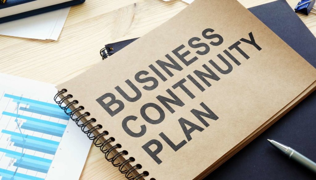 notebook with business continuity plan