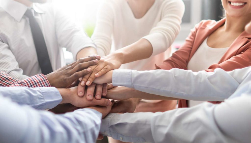 group of people holding hands