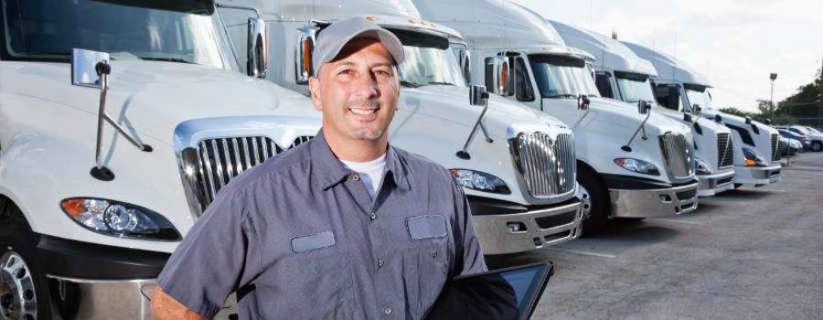 man in front of tractor trailers