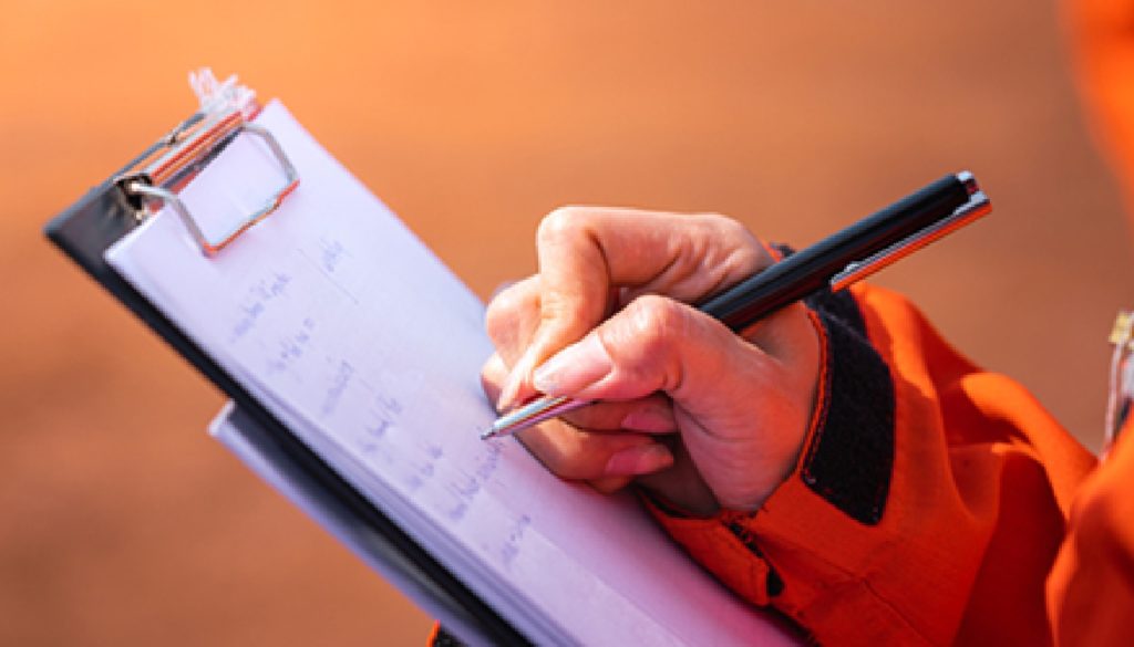 taking notes on clipboard