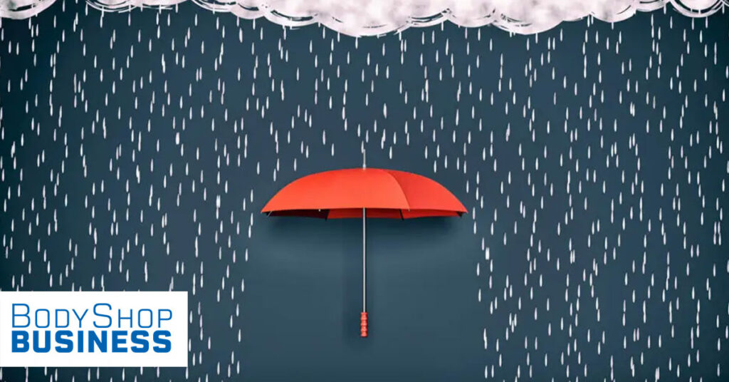 Image showing a red umbrella blocking rain with the Body Shop Business logo in the bottom left corner